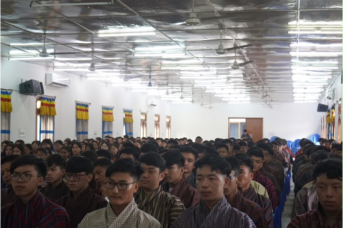 Students seated before the altar during a prayer session