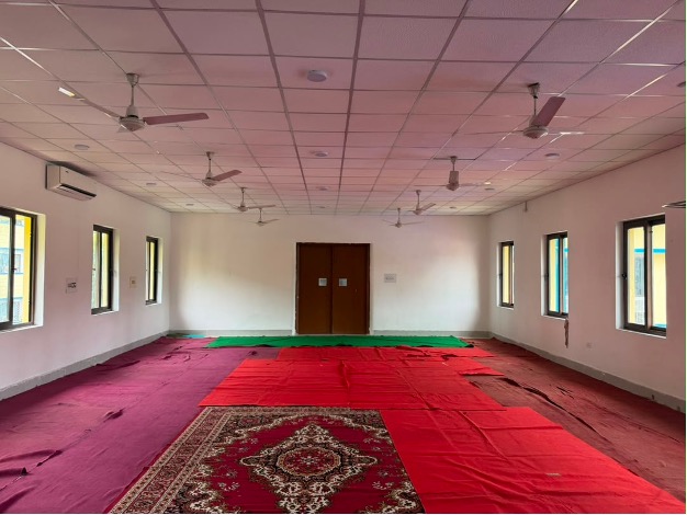 The existing hall with red carpet
